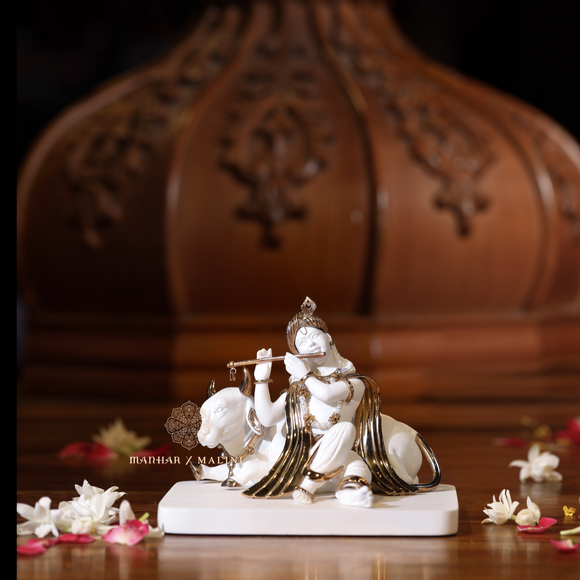 Krishna sitting with Cow
