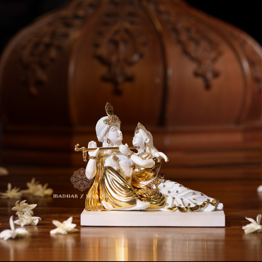 Radha Krishna (sitting)